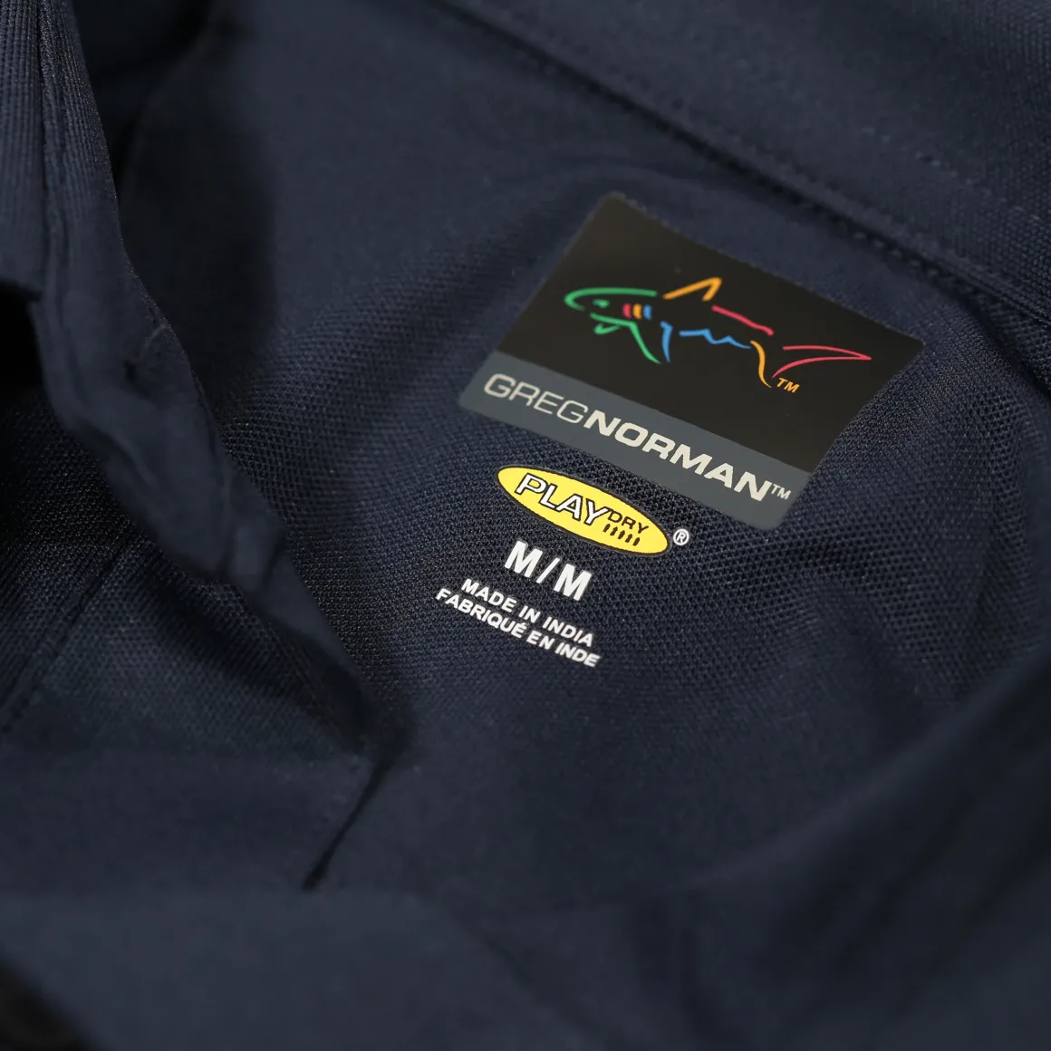 greg_norman_mens_neck_log_18-3.webp Greg Norman Men's Neck Logo Stretch Golf Polo Shirt