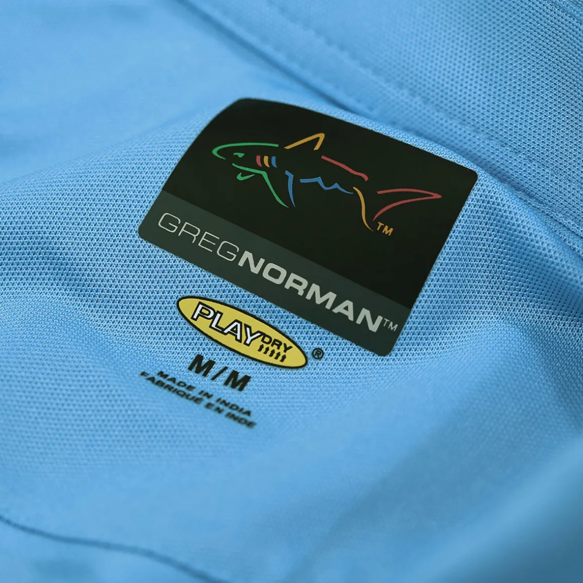 greg_norman_mens_shark_lo_7-8.webp Greg Norman Men's Shark Logo Golf Polo Shirt