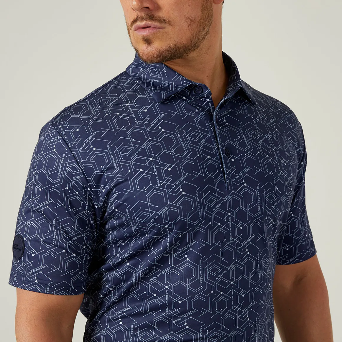 oscar_jacobson_mens_hollo_1.webp Oscar Jacobson Men's Hollow Geo Print Golf Polo Shirt